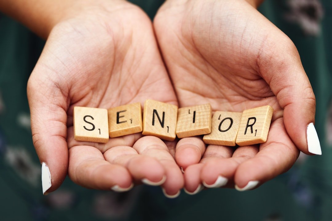 Macro shot of teen girl with manicured fingernails holding scrabble letters spelling the word SENIOR in the palms of her cupped hands.

This was my first shot during a senior portrait session a few years ago and taken spur of the moment in the parking lot at Kohler-Andrae State Park in Sheboygan, Wisconsin.
